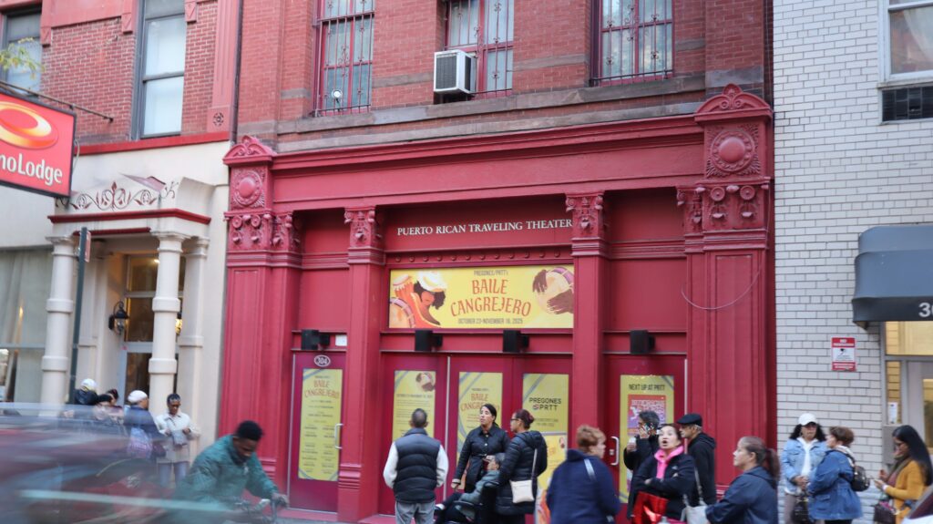 Baile Cangrejero environmental graphics displayed across the Pregones/PRTT facade with event attendees