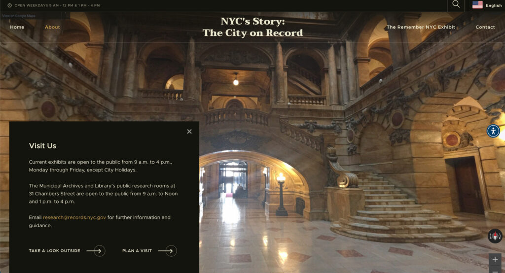 Visitors explore the Hall of Records through the interactive digital exhibit's map and visit experience, set over a photo of the building's grand marble staircase.